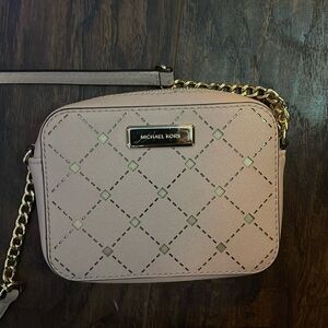 A Michael kors cross body purse barley worn